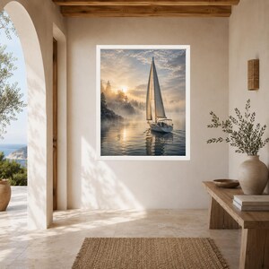 May include: A framed wall art print featuring a sailboat gliding across calm water during a misty sunrise. The scene includes a tall white sail, a forested shoreline partially obscured by fog, and golden sunlight reflecting on the water surface.