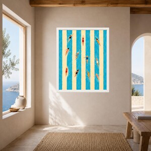 May include: A framed wall art print featuring a top-down view of multiple swimmers in various colored swimsuits, including red, blue, and yellow, swimming in lanes defined by alternating vertical stripes of bright blue and pale yellow.