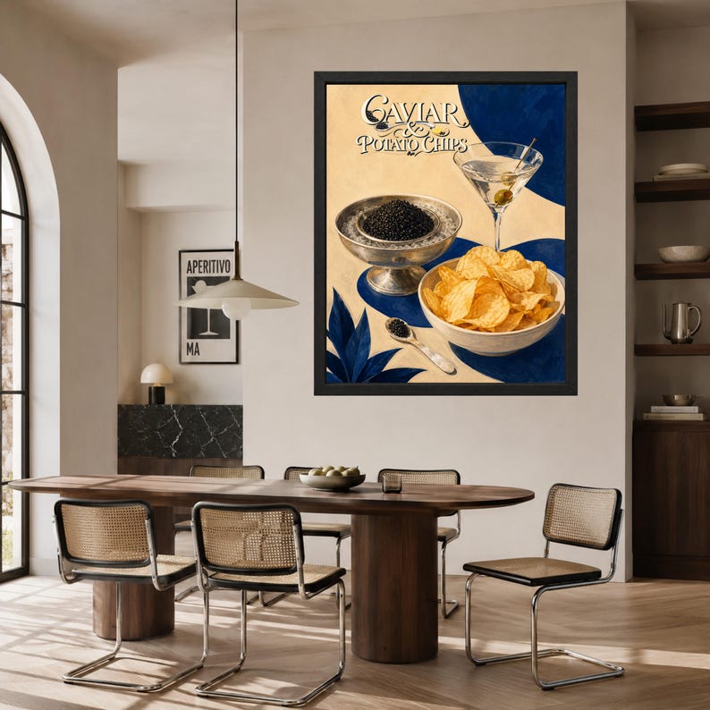 May include: A framed wall art print featuring the text Caviar & Potato Chips, displaying a silver bowl of black caviar, a bowl of golden potato chips, a martini glass with an olive, and a small spoon, set against a cream and blue background.
