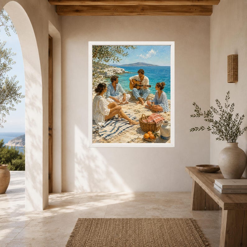 May include: A framed wall art print depicting a coastal scene with three people sitting on a rocky shore by the blue sea. One person plays an acoustic guitar while sitting on a striped blanket near a woven picnic basket filled with oranges.