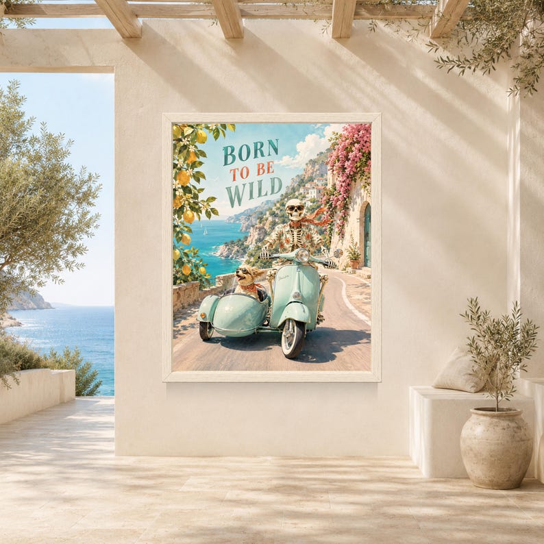 May include: A framed wall art print featuring a skeleton wearing sunglasses and a floral shirt riding a light blue scooter with a sidecar containing a small dog. The text BORN TO BE WILD is printed above. The scene depicts a coastal road with lemon trees and pink flowers.