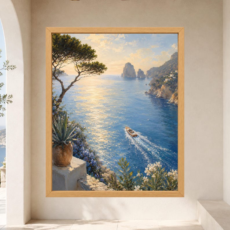 May include: A framed landscape painting depicting a coastal scene with a blue sea, a small motorboat leaving a wake, rocky cliffs, and distant rock formations. The foreground features a potted agave plant and white flowers under a golden sky.