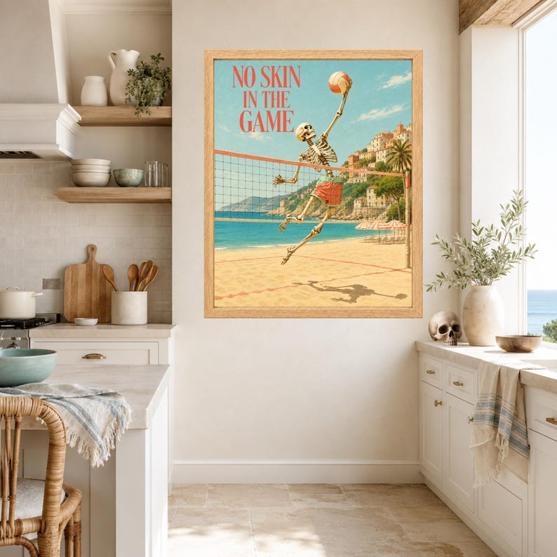 May include: A framed wall art print featuring a skeleton playing beach volleyball with the text NO SKIN IN THE GAME. The illustration shows a skeleton jumping to hit a volleyball over a net on a sandy beach with a coastal town in the background.
