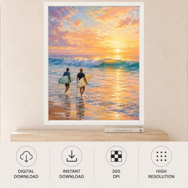 May include: A framed wall art print depicting two individuals carrying surfboards into the ocean at sunset. The sky is filled with vibrant orange, pink, and yellow clouds above a breaking wave. The scene captures a calm beach at dusk.