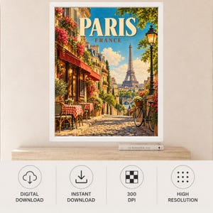 May include: A framed wall art print featuring a Parisian street scene with a cafe, red and white checkered tablecloths, a bicycle, and the Eiffel Tower in the distance. The text PARIS FRANCE is displayed at the top in a bold, cream-colored font.