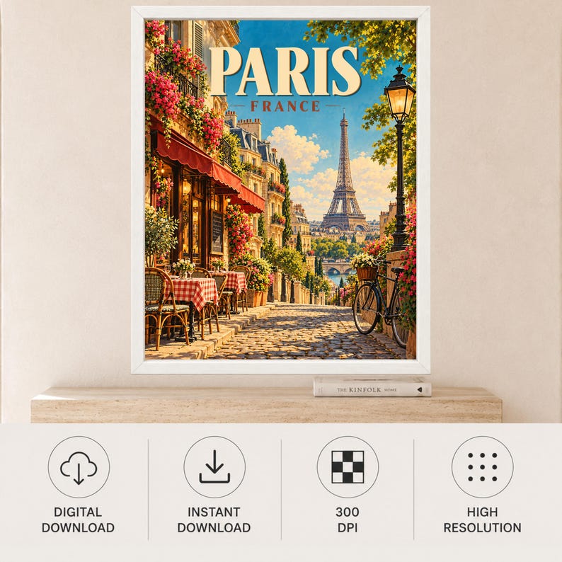 May include: A framed wall art print featuring a Parisian street scene with a cafe, red and white checkered tablecloths, a bicycle, and the Eiffel Tower in the distance. The text PARIS FRANCE is displayed at the top in a bold, cream-colored font.