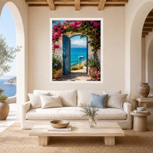 May include: A framed wall art print depicting an open blue door framed by vibrant pink bougainvillea flowers, revealing a view of a calm blue sea with a small white boat. The scene is set within a stone archway, capturing a coastal Mediterranean landscape.