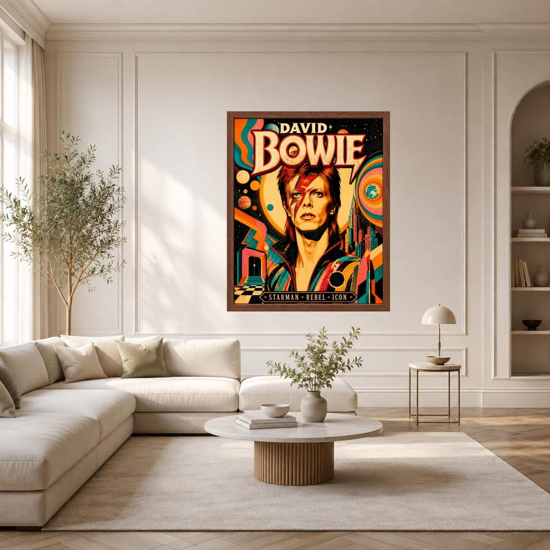 May include: A framed rectangular wall art print featuring a stylized portrait of David Bowie with a red lightning bolt across the face. The text reads DAVID BOWIE and STARMAN REBEL ICON. The background displays vibrant orange, blue, and yellow.