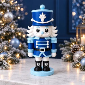 May include: A nutcracker figurine dressed in a blue uniform with white accents, a tall blue hat with a white emblem, a black belt with a white buckle, and black boots with white laces, standing on a light blue circular base.