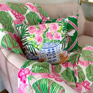 Chinoiserie chic pillow, ginger jar, cheetahs