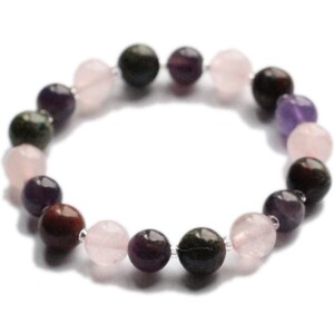 May include: A bracelet made of various gemstone beads, including pink, purple, and green. The beads are strung on a clear elastic cord.