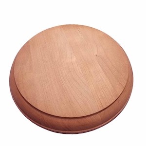 May include: A round, unfinished wooden plate with a raised, beveled edge. The plate is made of light-colored wood, showcasing the natural grain. The design is simple and classic, suitable for various craft projects or decorative purposes.