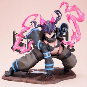 May include: A dynamic anime-style figurine of a character with dark hair and yellow eyes, wearing a black bra and brown pants with blue stripes. The figure is in a crouched pose, surrounded by translucent pink flame effects and dark hair tendrils.