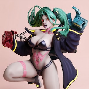 May include: A stylized figurine of a character with teal hair in pigtails, red eyes, and sharp teeth. The figure wears a dark jacket with yellow trim, a black bikini, and has pink tattoos on the neck and torso. One hand is a metallic teal robotic claw.