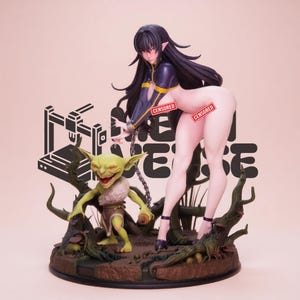 May include: A detailed anime-style figurine featuring a long-haired dark-haired character in a dark blue and yellow outfit, holding a metal chain attached to a small green goblin creature with pointed ears and a fur collar, set on a base.