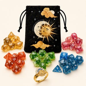 May include: A black drawstring pouch featuring a gold sun and moon graphic with the text I LOVE YOU LIKE THE MOON LOVES THE SUN, surrounded by four sets of glittery polyhedral dice in yellow, orange, green, and blue, and a gold sun and moon ring.