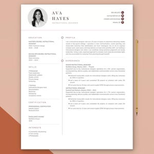 May include: A professional resume template featuring a clean white layout with dark text. It includes a circular headshot placeholder, contact details, and sections for education, skills, certification, interests, profile, and work experience.
