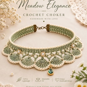 May include: A sage green and cream crochet choker featuring a scalloped edge, small white pearl accents, and a single teardrop-shaped emerald green pendant. The piece includes a bronze-toned metal clasp and chain for an adjustable fit.