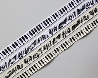 2 metres of Music themed ribbon, 10mm Grosgrain. Availible in either a musical notes, or a piano key theme, in white or cream (Q7)
