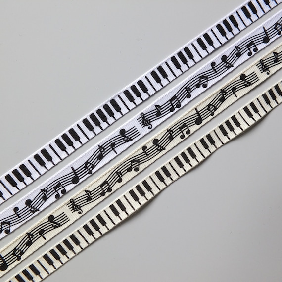 Music themed ribbon, 10mm Grosgrain. Available in either a musical notes, or a piano key theme, in white or cream