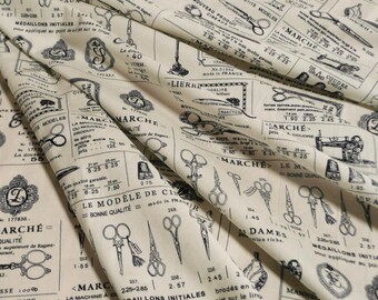May include: A beige fabric with a black and white print of vintage sewing tools, scissors, and text in French. The text includes "Le Modele de Ciseaux" and "Bonne Qualite".