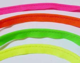 2mm flanged insertion piping on a 9mm band, Neon colours, yellow, green, pink, orange - sold by the metre (THE WALL)