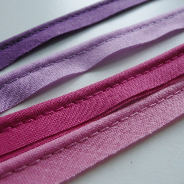 2mm flanged insertion piping on a 9mm band, shades of Pink, Lilac, and Purple - sold by the metre (THE WALL)