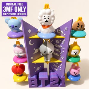 May include: A purple 3D-printed display stand featuring the text BT21, KOYA, RJ, SHOOKY, MANG, CHIMMY, TATA, COOKY, and VAN. The stand holds eight colorful character figurines on tiered shelves. A digital file notice is visible in the top left corner.