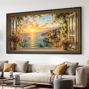 Könnte beinhalten: Ein rechteckiger Wandkunstdruck, der den Blick aus einem offenen Fenster auf einen Küstensonnenuntergang über dem Meer zeigt. Die Szene umfasst eine goldene Sonne, Segelboote, ein Dorf am Hang mit Häusern und üppiges grünes Blattwerk.