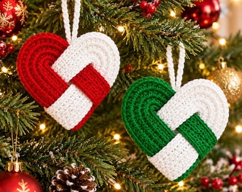 May include: Two heart-shaped ornaments made of crocheted yarn. One ornament features a woven pattern of red and white yarn, while the other features a woven pattern of green and white yarn. Each heart includes a matching crocheted loop for hanging.