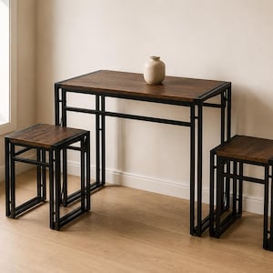 May include: A rectangular table with a dark wood-grain top and a black metal frame, accompanied by two matching square stools with dark wood-grain seats and black metal frames. A small, light-colored ceramic vase sits on the table surface.