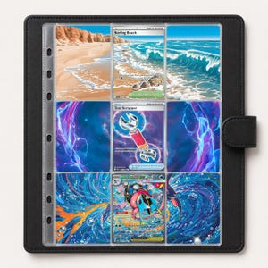 May include: A black leather-textured trading card binder featuring nine clear plastic pockets. The binder displays three collectible cards: Surfing Beach, Tool Scrapper, and Mega Greninja EX, each showcasing vibrant illustrations of coastal scenes and action.