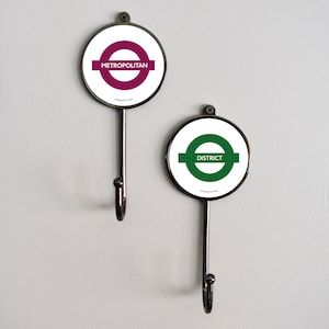 Perchero de pared para ropa, estación de metro de Londres
