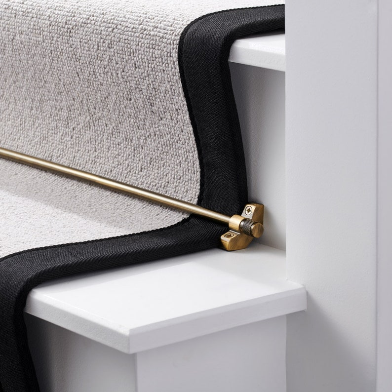 A brass stair rod featuring knurled end caps which will give a contemporary feel to any home.
Available in a gold, silver, antique gold and black finish. 
Can be easily cut to desired length and are the perfect finish to any staircase.