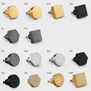 May include: A collection of cabinet knobs in various shapes including hexagonal, circular, and square designs. The knobs feature finishes in gold, matte black, silver, and brushed metal tones, each labelled with codes P10, P90, P70, P55, P1, P79, P3, P93, P92, P91, P27, P32, P182, and P189.