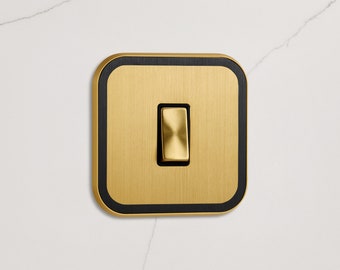 Gold Rocker Light Switch with Black Insert