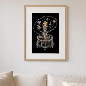 May include: A framed wall art print featuring a detailed white line illustration of a mechanical orrery against a solid black background. The artwork depicts a complex system of gears, spheres, and orbital rings, centered on a glowing golden sun.