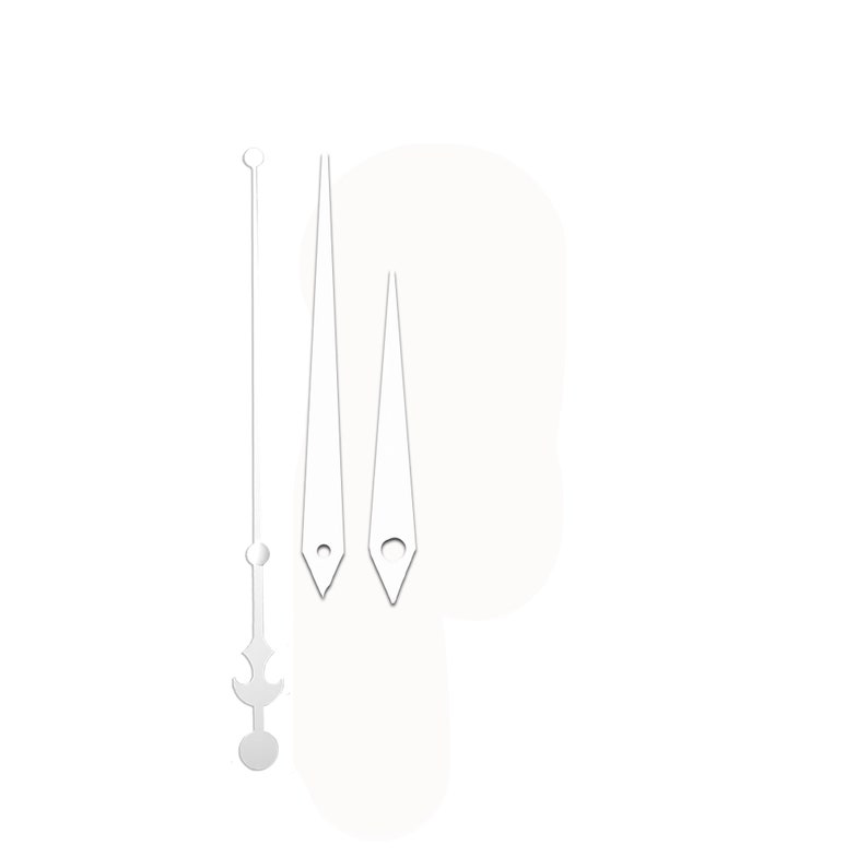 May include: A set of three silver clock hands. The longest hand has a circular top and a decorative bottom. The other two hands are triangular with a small hole near the tip. The hands are against a white background.