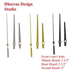May include: Set of clock hands in silver, gold, and black. The minute hand is 3 1/2 inches long, the hour hand is 2 1/2 inches long, and the second hand is 4 inches long.