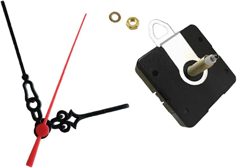 May include: Clock parts, including a black clock movement, black and red clock hands, a brass nut, and a brass washer. The clock hands are black with decorative designs. The second hand is red. The clock movement is square and black.