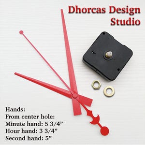 May include: Red clock hands with a black clock mechanism. The minute hand is 5 3/4 inches long, the hour hand is 3 3/4 inches long, and the second hand is 5 inches long. The text "Dhorcas Design Studio" is visible in the image.
