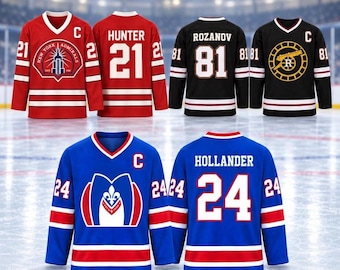 May include: A collection of three hockey jerseys in red, black, and blue. The red jersey features the New York Admirals logo and number 21. The black jersey displays the name Rozanov and number 81. The blue jersey shows the name Hollander and number 24.