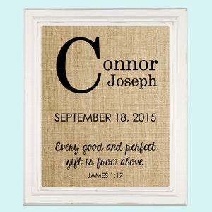 May include: A burlap framed print with the name Connor Joseph and the date 18 September 2015. The print also includes the quote "Every good and perfect gift is from above." and the scripture reference "JAMES 1:17".