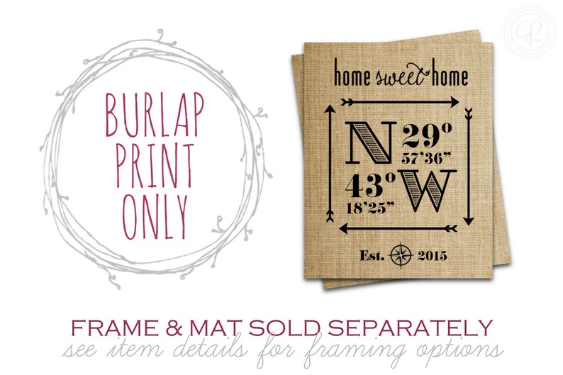 May include: A burlap print with the text "home sweet home" and coordinates "N 29&deg; 57'36" 43&deg; 18'25" W" and "Est. 2015". The print is framed with a gray wreath.