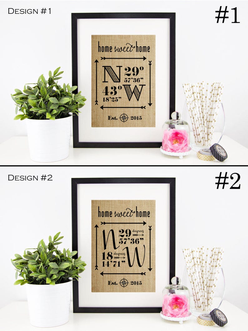 May include: Two framed prints with a burlap background and black text. The text reads "home sweet home" and includes coordinates with degrees, minutes, and seconds. The prints are labeled "Design #1" and "Design #2".