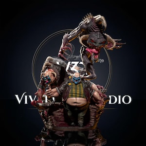 May include: A detailed multi-character figurine featuring a central clown figure with a blue face, yellow and black checkered shirt, and dark jacket, accompanied by a larger, horned, dark-skinned creature with red eyes and a long tongue.