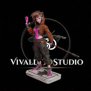 May include: A stylized figurine of a character with brown hair wearing a brown jacket, pink top, and dark gray cargo pants. The character holds a pink card and a long staff, standing on a base shaped like a stack of playing cards with a spade symbol.