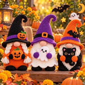May include: Three handmade crochet gnomes with Halloween themes. The left gnome wears a black hat and holds a pumpkin. The center gnome wears a purple hat and holds a white ghost. The right gnome wears an orange hat and holds a black cat.