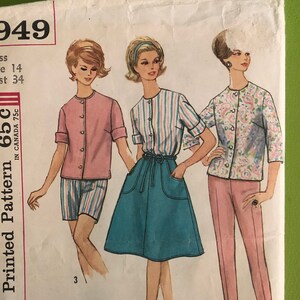 May include: Simplicity Printed Pattern 65c. Sewing pattern for a skirt, shorts, and blouse. The pattern is for size 14, bust 34. The pattern is illustrated with three women wearing the garments.