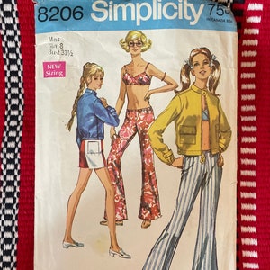 May include: Vintage Simplicity sewing pattern number 8206 for a misses' size 8-18, bust 31 1/2. The pattern includes instructions for a jacket, pants, and a top. The pattern is new sizing. The pattern cover features three models wearing the garments.